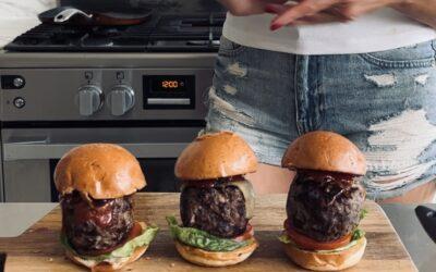 Cheddar-stuffed burgers with caramelized onions